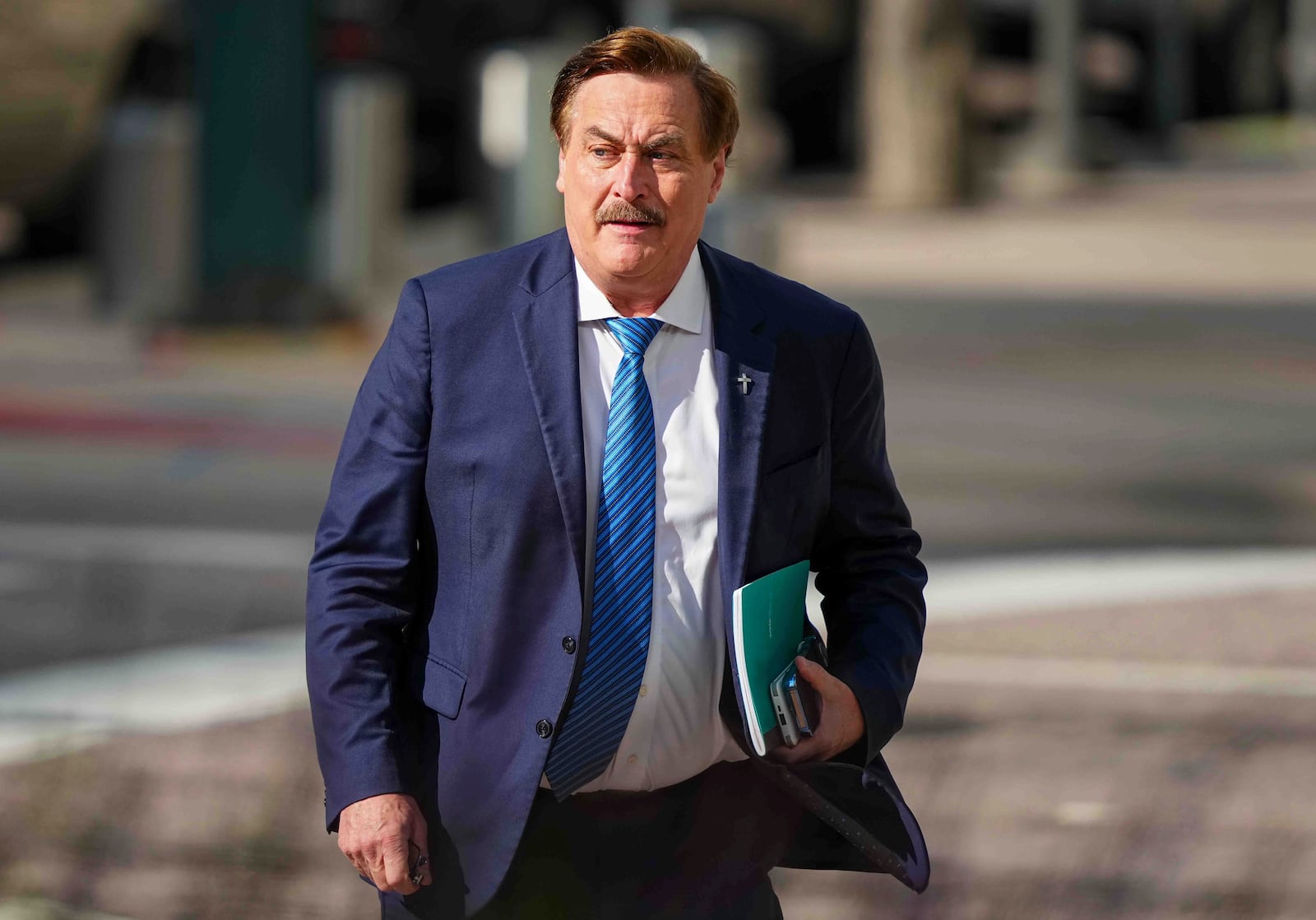 Mike Lindell walks into federal district court for a defamation trial on Thursday, June 5, 2025, in Denver. (AP Photo/Jack Dempsey)