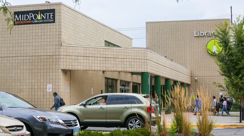 The MidPointe Library in Middletown has removed the doors to their restrooms, which as helped curb drug use at their facility. GREG LYNCH / STAFF
