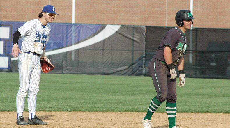 Hamilton High School shortstop Kurtis Reid does some talking with Mason's J.P. Sponseller on Thursday, April 18, 2019, during a Greater Miami Conference baseball game at Hamilton. FILE PHOTO
