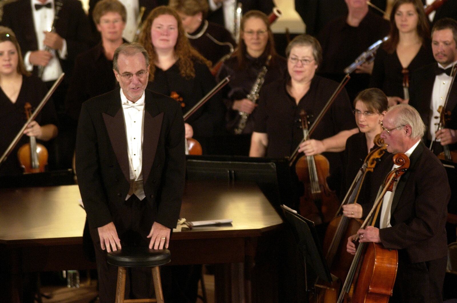 GREG LYNCH/JOURNALNEWS
Paul Stanbery, the Music Director and Conductor for the Hamilton Fairfield Symphony Orchestra leads the annual Tillman Concert at St. Julie Billiart Church, Sunday afternoon.  Stanbery was honored before the concert during a 10th anniversay celebration of his tenure with the Hamilton Fairfield Symphony Orchestra.