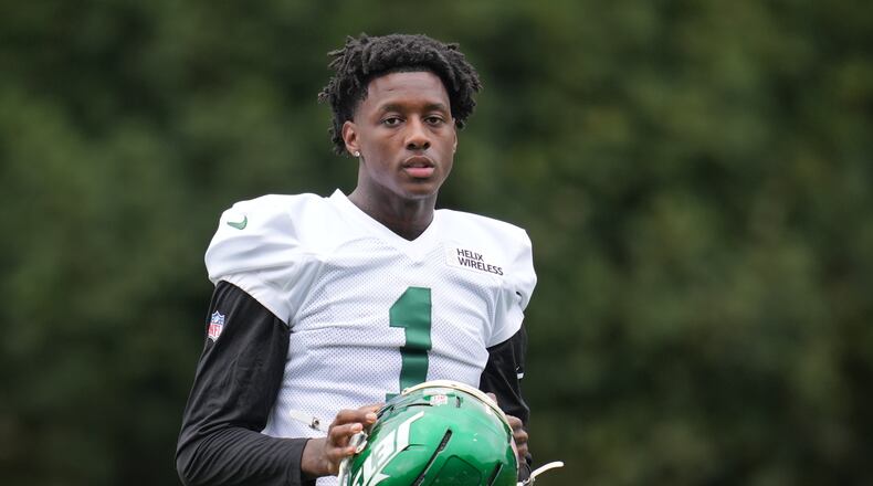 New York Jets cornerback Sauce Gardner (1) looks on during NFL football practice at The Grove in Watford, England, Wednesday, Oct. 8, 2025. (AP Photo/Kin Cheung)