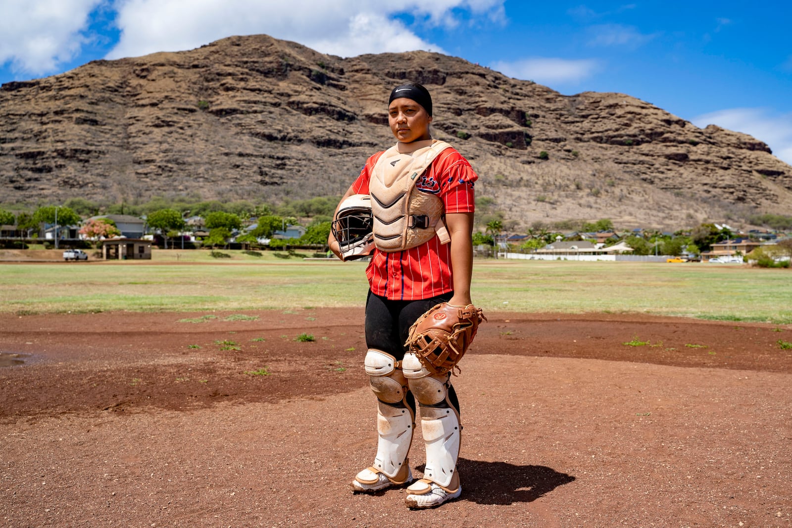 Ry-n Uyeda, 17, a senior at Waianae High School, poses for a portrait, Friday, July 11, 2025, in Waianae, Hawaii. (AP Photo/Mengshin Lin)