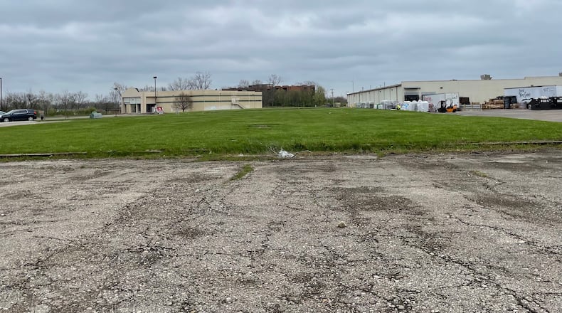 Tami and Jasen Hatfield are making plans to build a miniature golf course complex at 845 NW Washington Blvd. on the west side of Hamilton. They present the idea to plan a commission this month as a pre-application presentation. The land is a triangular parcel Behind a veterinarian clinic and next to the former Danberry theater (pictured in the back). MICHAEL D. PITMAN/ STAFF