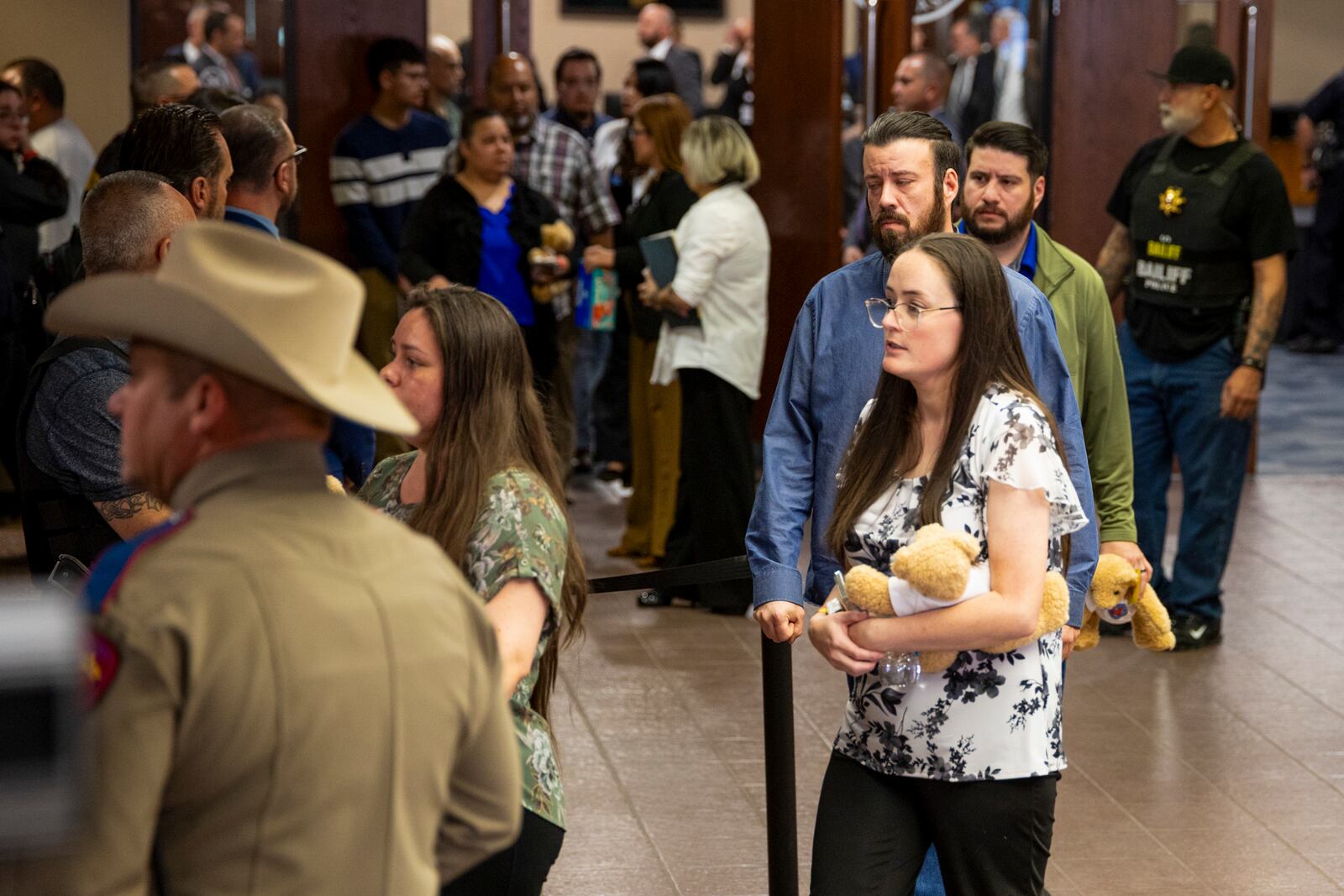 Families embrace as they leave the 409th District Court after Patrick Crusius pleaded guilty in the death of 23 people in the Aug. 3. 2019 Walmart Mass shooting, Monday, April 21, 2025, in El Paso, Texas. (AP Photo/Ivan Pierre Aguirre)