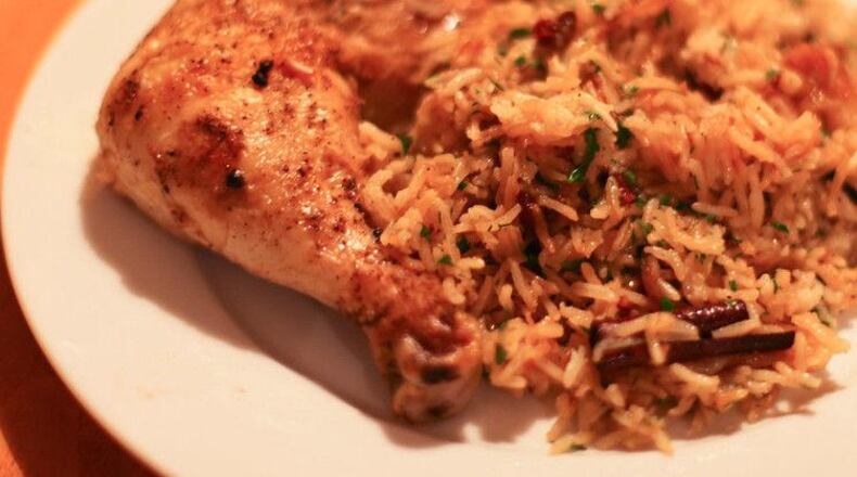 Cajun Chicken and Caramelized Onion Rice. LINDA GASSENHEIMER/TRIBUNE NEWS SERVICE