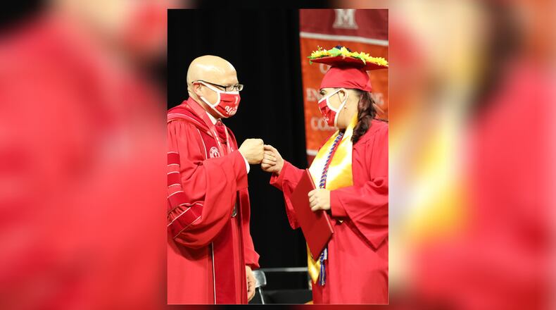 Miami University President Crawford celebrating with a 2021 graduate. Miami University Regionals will host information sessions for Integrative Studies and Liberal Studies at noon March 3 in Middletown and at 6:30 p.m. March 31 in Hamilton. Both sessions offer a virtual option. CONTRIBUTED