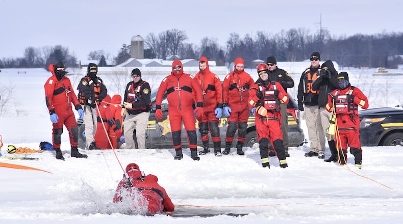 The Butler County Sheriff's Office held a water rescue training on an ice covered pond Tuesday, February 16, 2021 on Tolbert Road in Wayne Township. NICK GRAHAM / STAFF