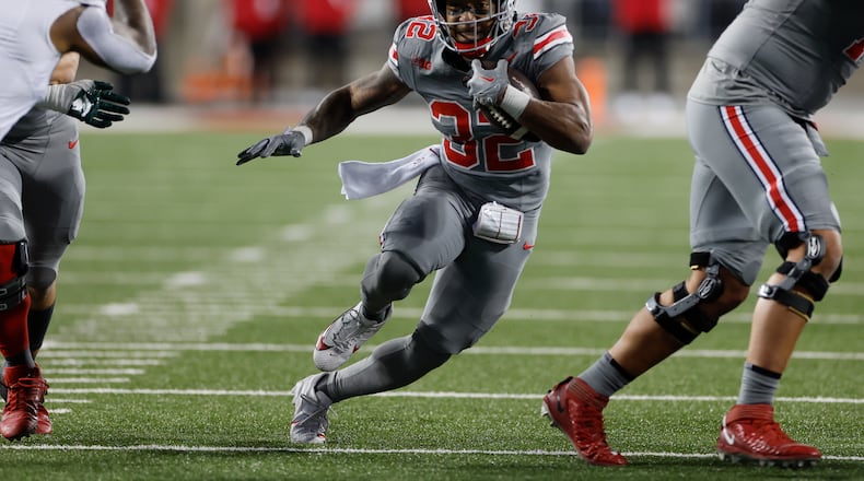 FILE - Ohio State running back TreVeyon Henderson plays against Michigan State during an NCAA college football game Saturday, Nov. 11, 2023, in Columbus, Ohio. TreVeyon Henderson said Wednesday, Dec. 27, 2023 that he would play when Buckeyes (11-1) play Missouri (10-2) in the Cotton Bowl.(AP Photo/Jay LaPrete, File)