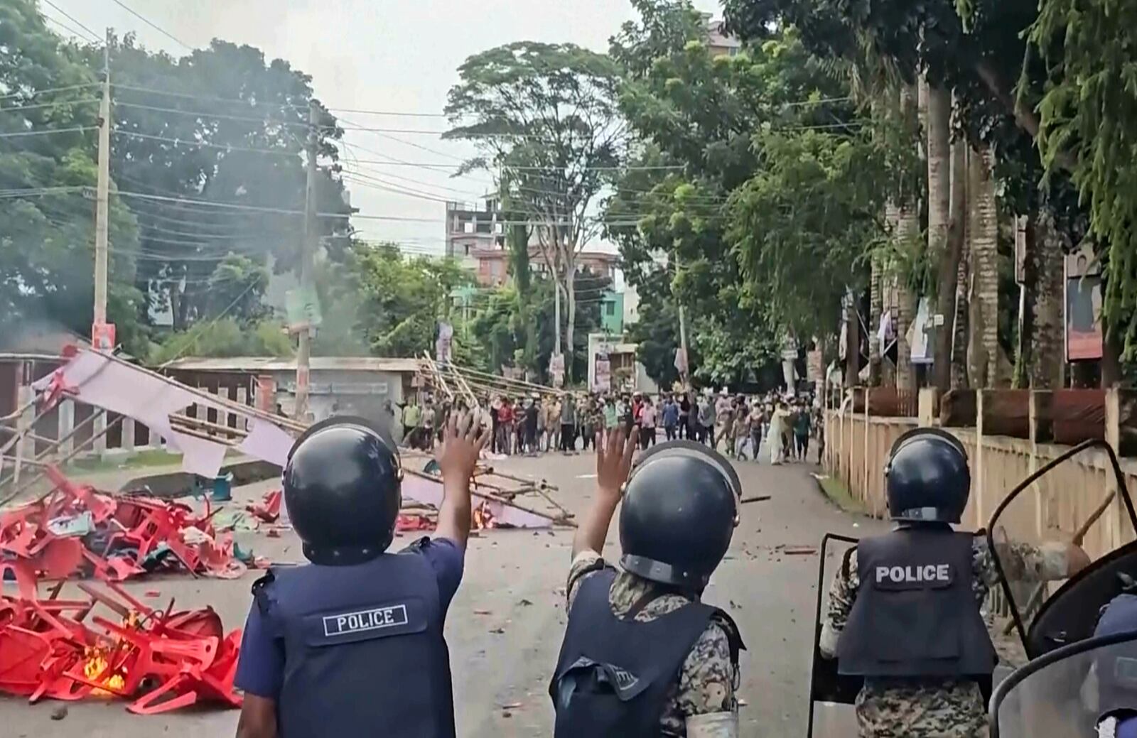 In this image made from a video, supporters of the ousted Prime Minister Sheikh Hasina clash with the police in Gopalganj, Bangladesh, Wednesday, July 16, 2025. (AP Photo)