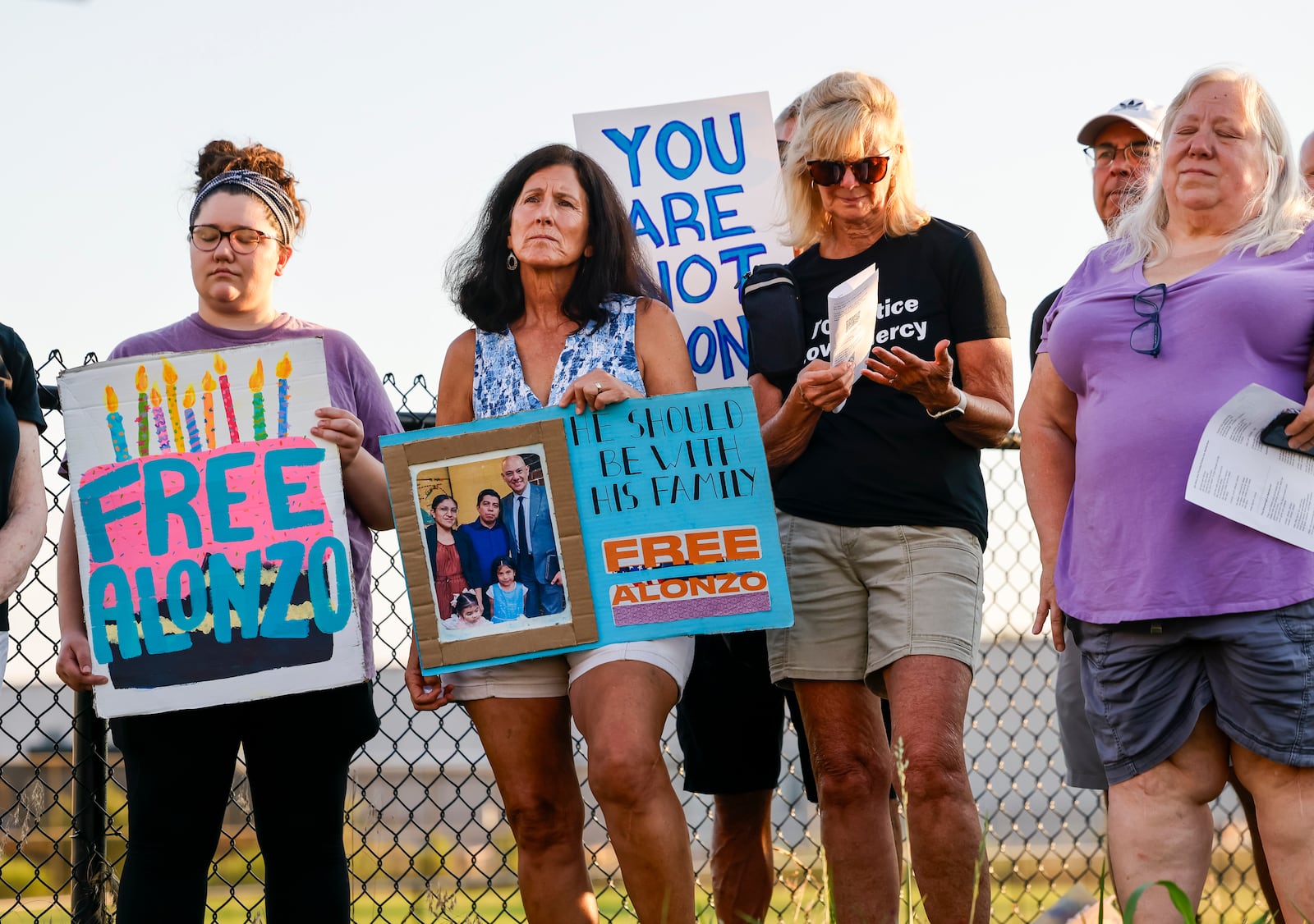 Over 100 faith leaders and advocates hold a candlelight vigil for Alonzo Tomas Mendez and other immigrants being held in Butler County Jail Tuesday, July 1, 2025 just outside the fence of the Butler County Sheriff's Office in Hamilton. NICK GRAHAM/STAFF