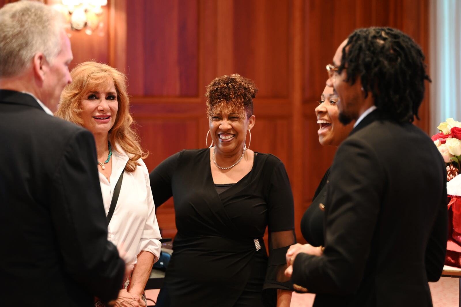 Flora Butler became the first African-American woman to be the president of the Hamilton Rotary Club, which began in 1919. Pictured is Butler (center) with Woody and Diane Fitton (at left) and her two adult children, Andrea and Jonathan (at right), at the installment ceremony on Thursday, June 20, 2024, at the Fitton Center for Creative and Performing Arts in Hamilton, Ohio. MICHAEL D. PITMAN/STAFF