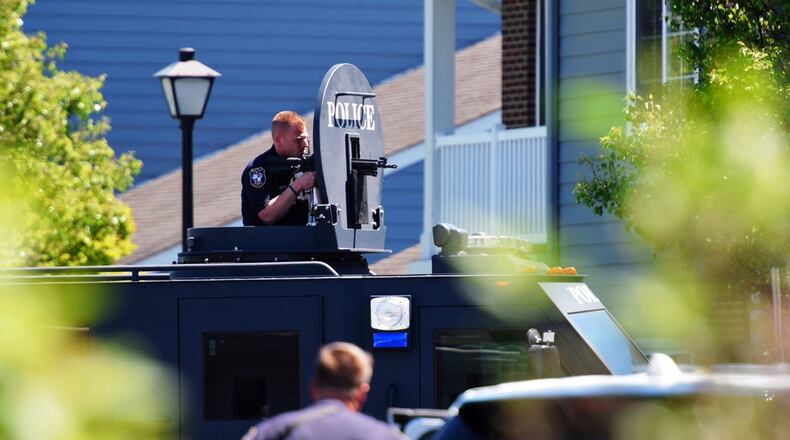 State lawmakers passed a bill that optionally allows a paramedic, or a trained medical personnel, attached to a SWAT team to carry a firearm when called so long as they are trained and authorized to carry the weapon. Pictured is a member of the West Chester Police SWAT team back in April 2017 when called out to the Landings at Beckett Ridge. NICK GRAHAM/FILE