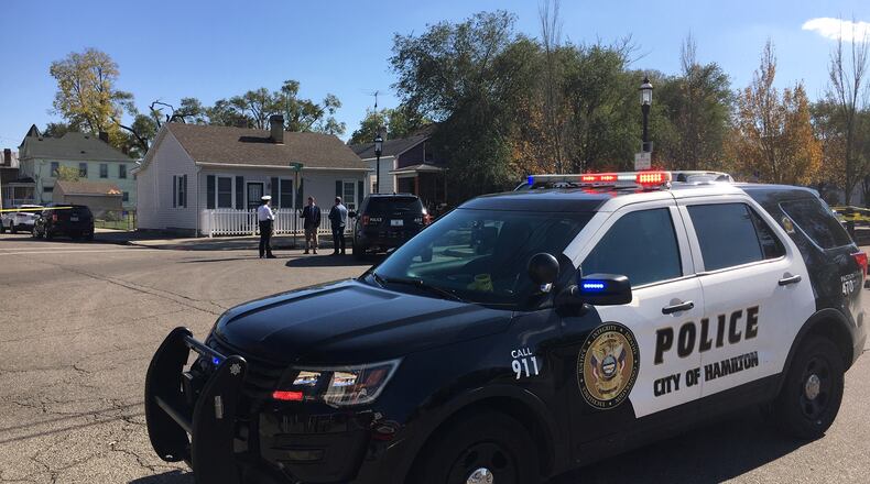 Hamilton police responded to the corner of South Second and Walnut streets following a report of a person shot on Friday, Nov. 1, 2019. MICHAEL D. CLARK / STAFF