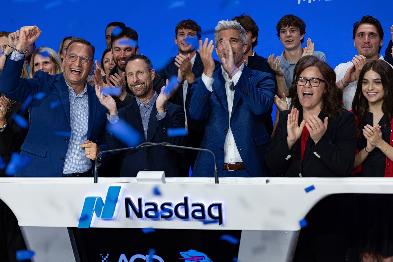 Jeffrey Housenbold, CEO and president of MrBeast, center, participates in a closing bell ceremony with MrBeast's "Beast Games" winner Jeffrey Allen, right, and Joe Brantuk, Nasdaq chief client officer, left, at their studio Wednesday, July 23, 2025, in New York's Times Square. (AP Photo/Stefan Jeremiah)