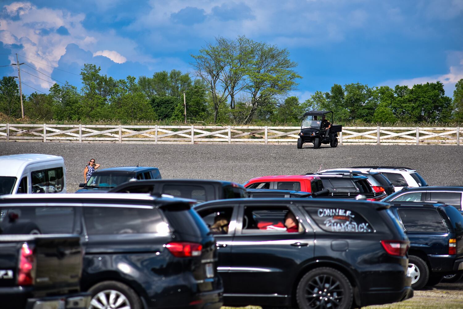 Madison High School drive-thru graduation ceremony at Land of Illusion