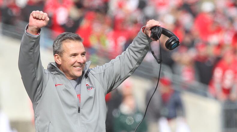 Ohio State’s Urban Meyer celebrates a tackle by the special teams against Michigan State on Saturday, Nov. 11, 2017, at Ohio Stadium in Columbus. David Jablonski/Staff