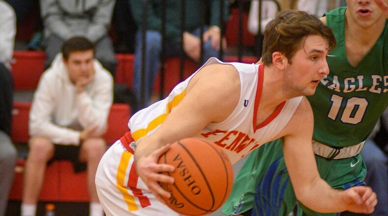 Fenwick’s Jared Morris looks to push the ball against Chaminade Julienne’s Jack Nauseef on Friday night in Middletown. CJ won 68-63 in double overtime. ROB MCCULLEY/RAM PHOTOGRAPHY
