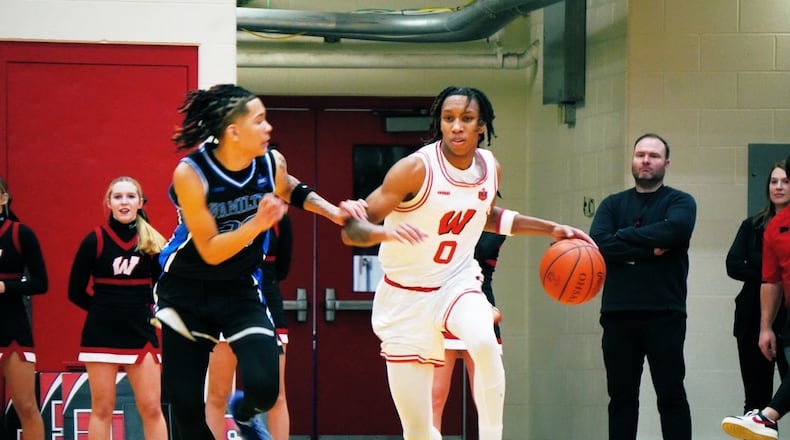 Lakota West's Bryson Curry brings the ball up against Hamilton's Tizirai Mamutse on Friday night. Chris Vogt/CONTRIBUTED