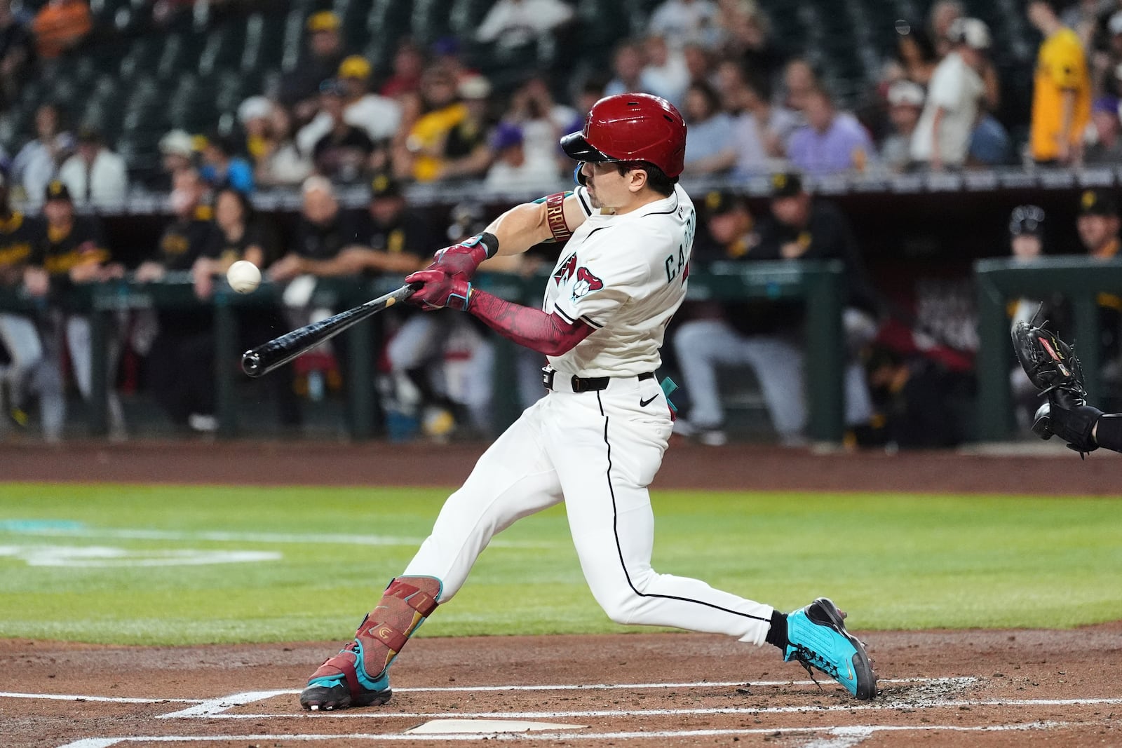 Arizona Diamondbacks' Corbin Carroll connects for a home run against the Pittsburgh Pirates during the first inning of a baseball game Tuesday, May 27, 2025, in Phoenix. (AP Photo/Ross D. Franklin)