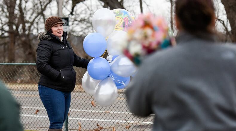 Rebecca Sandle, the mother of CJ Sandle, who was murdered in 2016, gathered with friends for a balloon launch on what would have been CJ’s 21st birthday Tuesday, Jan. 10, 2017 at Greenwood Cemetery in Hamilton. Jan. 13 marks the first anniversary of the murder of CJ Sandle in his Hamilton home. His mother, Rebecca, has taken to social media asking people to mark the day with a random act of kindness. NICK GRAHAM/STAFF