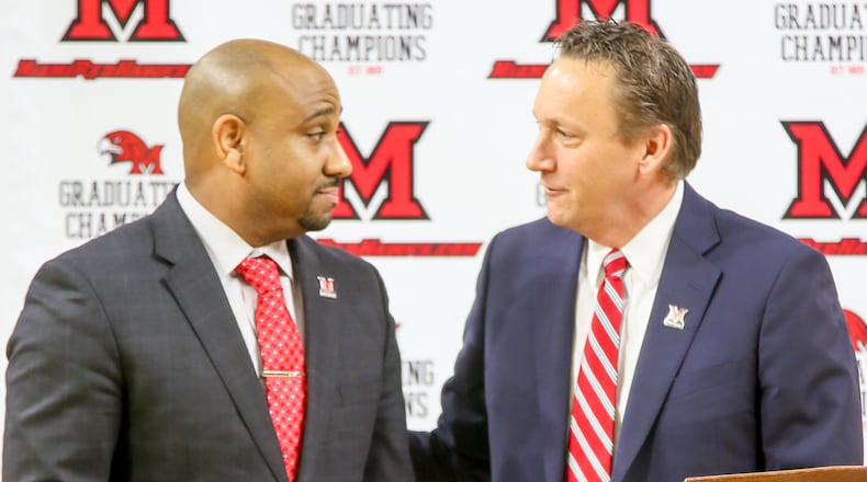 Jack Owens, the new Miami University head basketball coach, is introduced by David Sayler, Miami University Athletic Director, during a public event at Millett Hall in Oxford, Thursday, Mar. 30, 2017. GREG LYNCH / STAFF