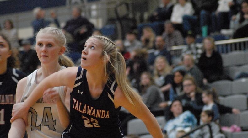 Talawanda junior Myah Keene (22) boxes out Edgewood freshman Ella Allen (24) during a free throw attempt on Wednesday night. Chris Vogt/CONTRIBUTED