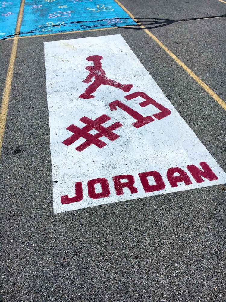 PHOTOS Lakota East seniors paint parking spots