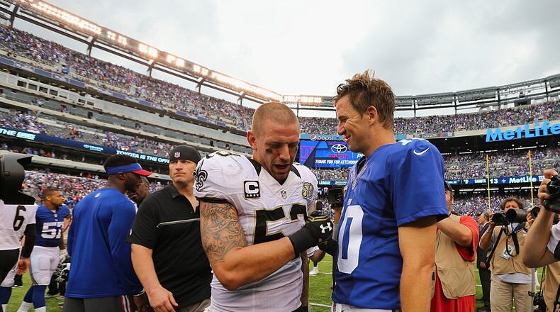EAST RUTHERFORD, NJ - SEPTEMBER 18: Quarterback Eli Manning #10 of the New York Giants talks with James Laurinaitis #53 of the New Orleans Saints after their game at MetLife Stadium on September 18, 2016 in East Rutherford, New Jersey. New York Giants won 16-13. (Photo by Michael Reaves/Getty Images)