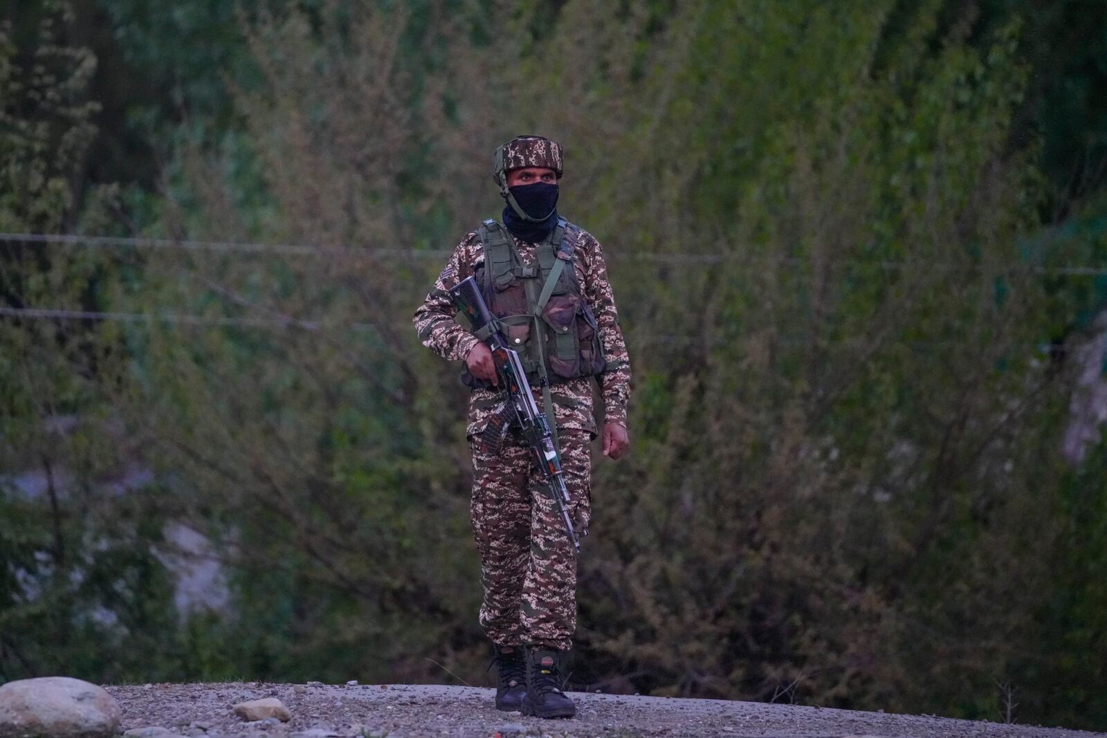 Indian security officer stand guard near Pahalgam in south Kashmir after assailants indiscriminately opened fired at tourists visiting Pahalgam, Indian controlled Kashmir, Tuesday, April 22, 2025.(AP Photo/Dar Yasin)