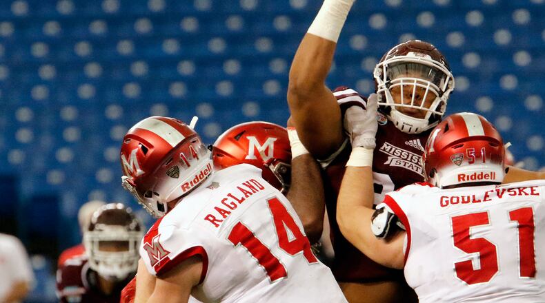 ST. PETERSBURG, FL - DECEMBER 26: Defensive lineman Braxton Hoyett #95 of the Mississippi State Bulldogs tries to block a pass by quarterback Gus Ragland #14 of the Miami (Oh) Redhawks during the second quarter in the St. Petersburg Bowl at Tropicana Field on December 26, 2016, in St. Petersburg, Florida. (Photo by Joseph Garnett, Jr. /Getty Images)