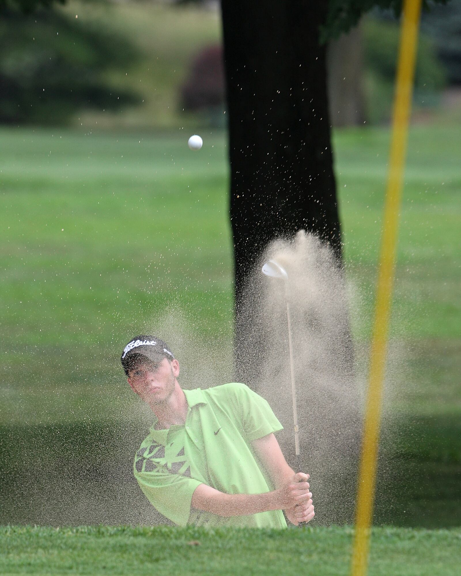 Ryan Barnes hits form the bunker on the 7th hole during the Fairfield City Golf Championship, Sunday, July 24, 2011, at Fairfield Greens South Trace golf course. Photo by Robert Leifheit/Contributing Photographer