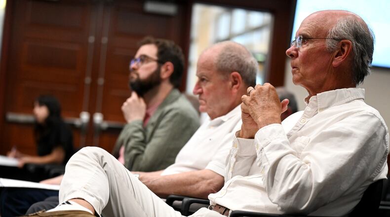 Ken Schon, with the Cincinnati area developer Bloomfield/Schon, listens during a discussion of his redevelopment project in Lindenwald at Hamilton City Council meeting on Wednesday, June 11, 2025. Bloomfield/Schon is planning a $29 million redevelopment project at the former Shuler & Benninghofen Woolen Mill. Schon is pictured Steve Bloomfield (center) and Adam Bloomfield. MICHAEL D. PITMAN/STAFF