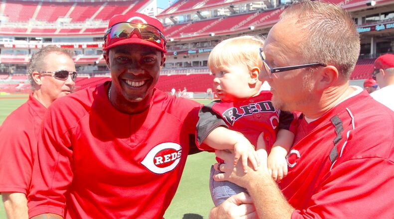 Reds closer Raisel Iglesias poses for a photo with fans before a game against the Cubs on Sunday, July 2, 2017, at Great American Ball Park in Cincinnati.