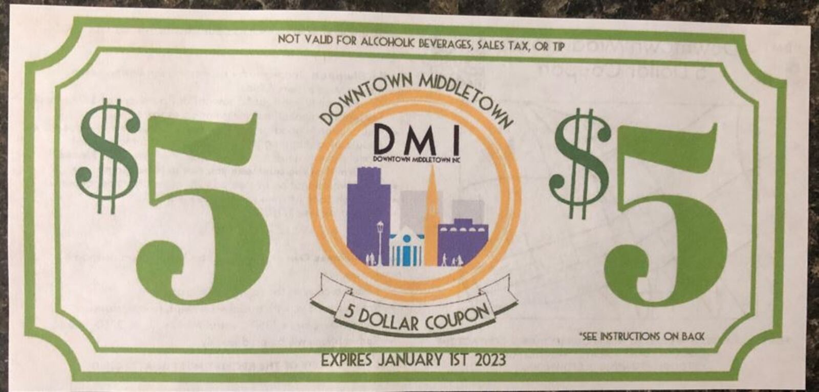 Downtown Middletown Inc. is passing out $5 coupons to be used at area businesses in hopes of increasing foot traffic. RICK McCRABB/STAFF
