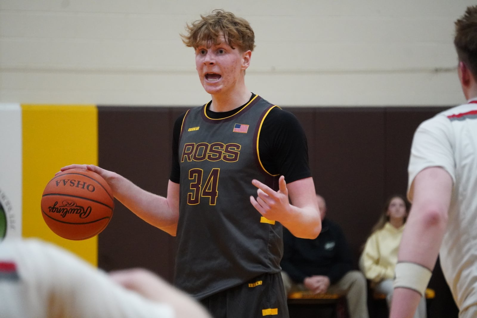 Ross junior Ethan Fuersich dribbles the ball up court during his Division III district semifinal game against Goshen on Monday night at Western Brown. CHRIS VOGT / CONTRIBUTED