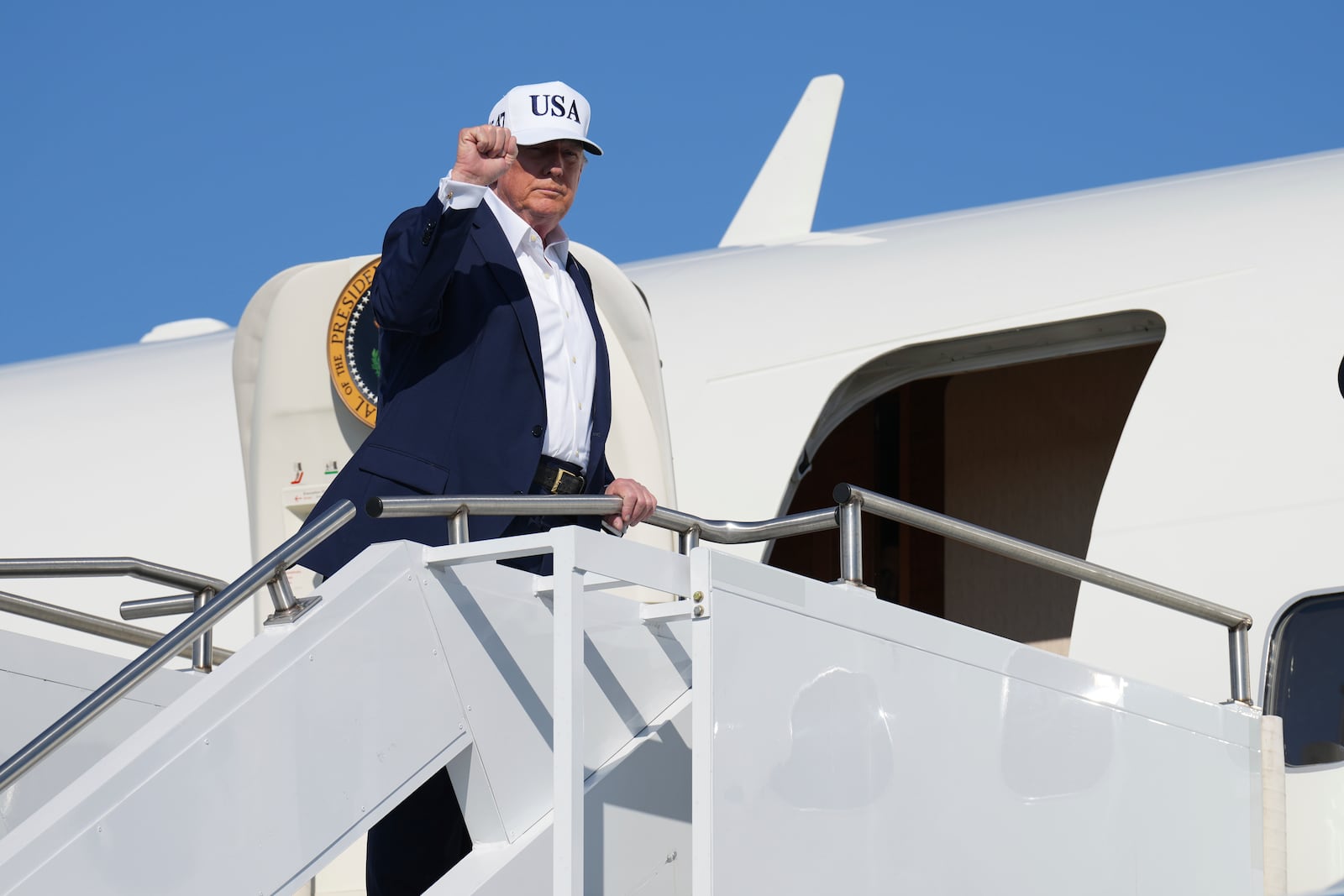 President Donald Trump boards Air Force One at Morristown Municipal Airport in Morristown, N.J., Sunday, July 6, 2025, en route to Washington. (AP Photo/Jacquelyn Martin)