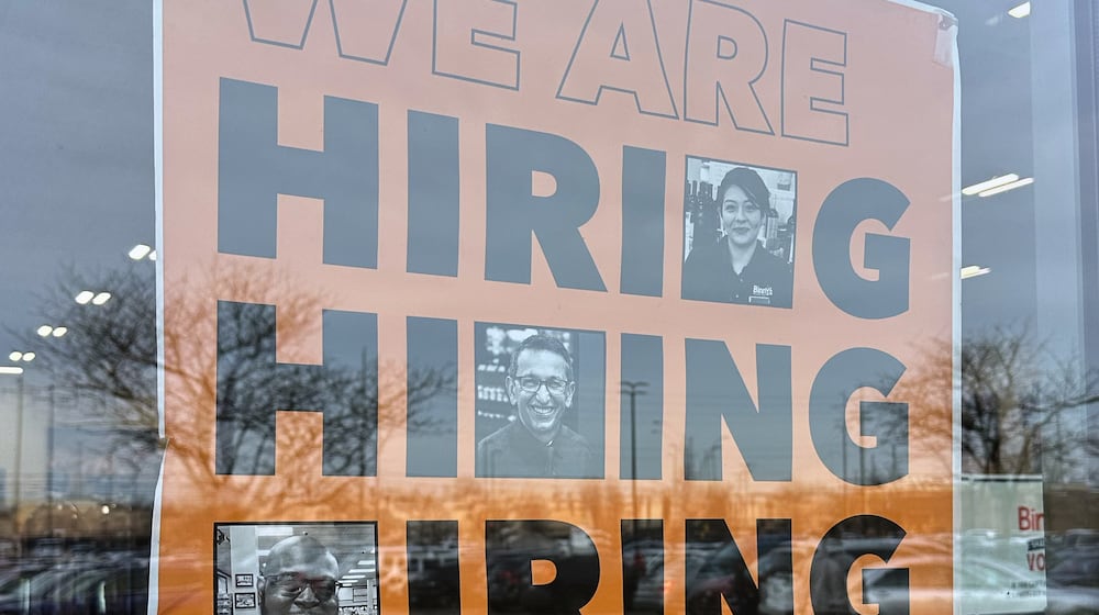Hiring sign is displayed at a grocery store in Arlington Heights, Ill., Wednesday, Dec. 24, 2025. (AP Photo/Nam Y. Huh)