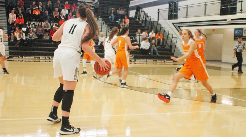 Mercy McAuley’s Cecilia Horn (22) is about to come after Lakota East’s Jessica Motley (11), who’s looking across the court during a Nov. 24, 2018, game in Liberty Township. East lost 48-26. RICK CASSANO/STAFF
