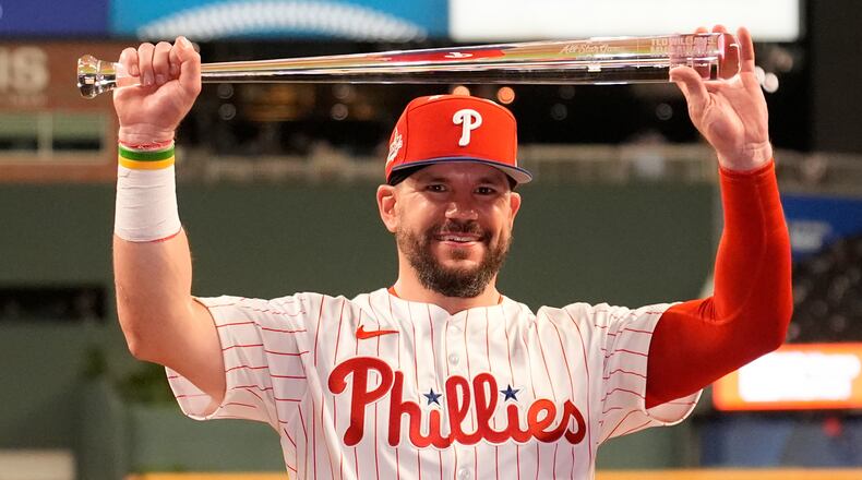 Philadelphia Phillies Kyle Schwarber celebrates after winning the tiebreaker at the MLB baseball All-Star game between the American League and National League, Tuesday, July 15, 2025, in Atlanta. (AP Photo/Brynn Anderson)