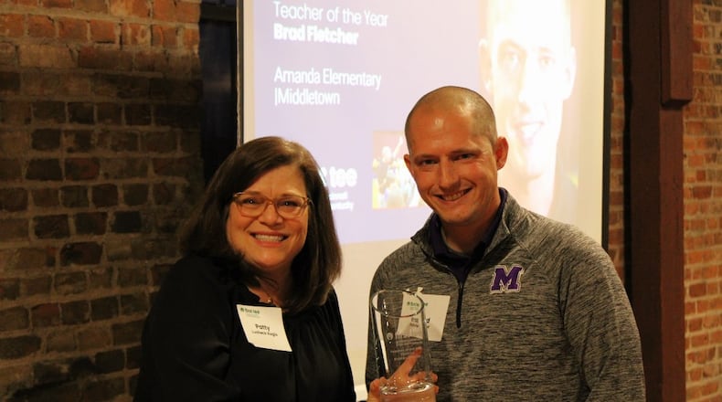 At a recent ceremony at Glenview Golf Course’s clubhouse, Brad Fletcher, the physical education teacher at Middletown Schools’ Amanda Elementary, was named the “Teacher of the Year” by First Tee Greater Cincinnati & Northern Kentucky (GCNKY) Chapter. Fletcher is the first person to receive the award from the GCNKY Chapter. Fletcher, teaches the First Tee curriculum to students in both traditional and adaptive gym classes at the school. CONTRIBUTED