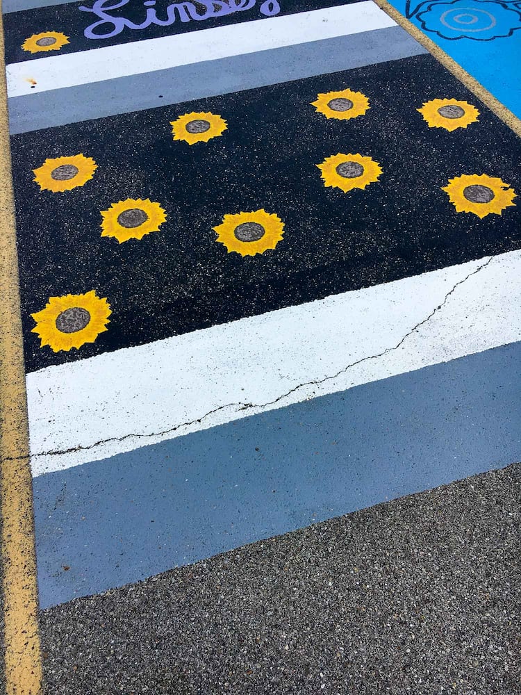 PHOTOS Lakota East seniors paint parking spots
