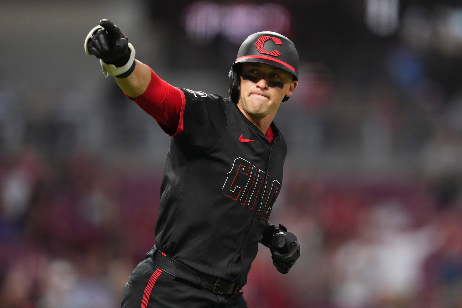 Cincinnati Reds' TJ Friedl gestures as he rounds the bases after hitting a two-run home run during the sixth inning of a baseball game against the Tampa Bay Rays, Friday, July 25, 2025, in Cincinnati. (AP Photo/Jeff Dean)