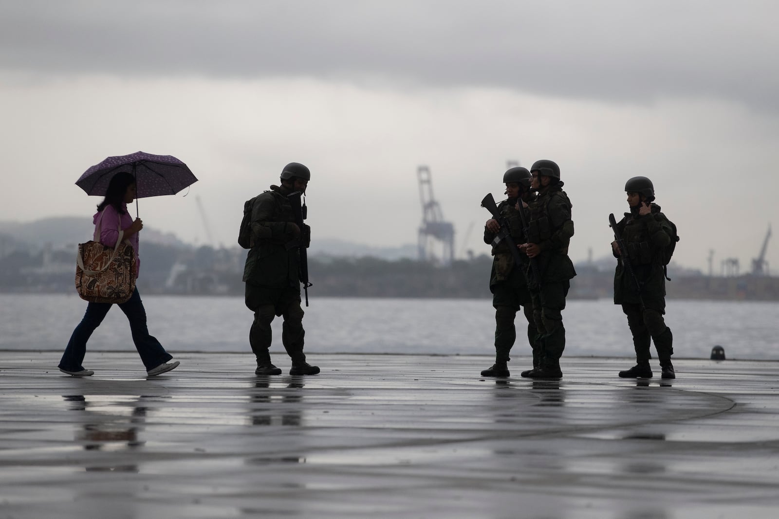 Members of the Brazilian Navy patrol along the Guanabara Bay waterfront, ahead of the upcoming 17th annual BRICS summit, in Rio de Janeiro, Thursday, July 3, 2025. (AP Photo/Bruna Prado)