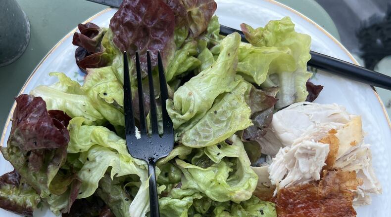 On a balcony in Paris/Montmartre, Whitney Kling enjoys a homemade meal of greens, chicken and potatoes. WHITNEY KLING/CONTRIBUTED