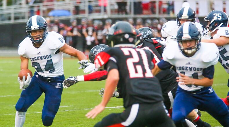 Edgewood running back Elijah Williams (24) looks for extra yards during a game at Franklin on Sept. 1, 2017. GREG LYNCH/STAFF
