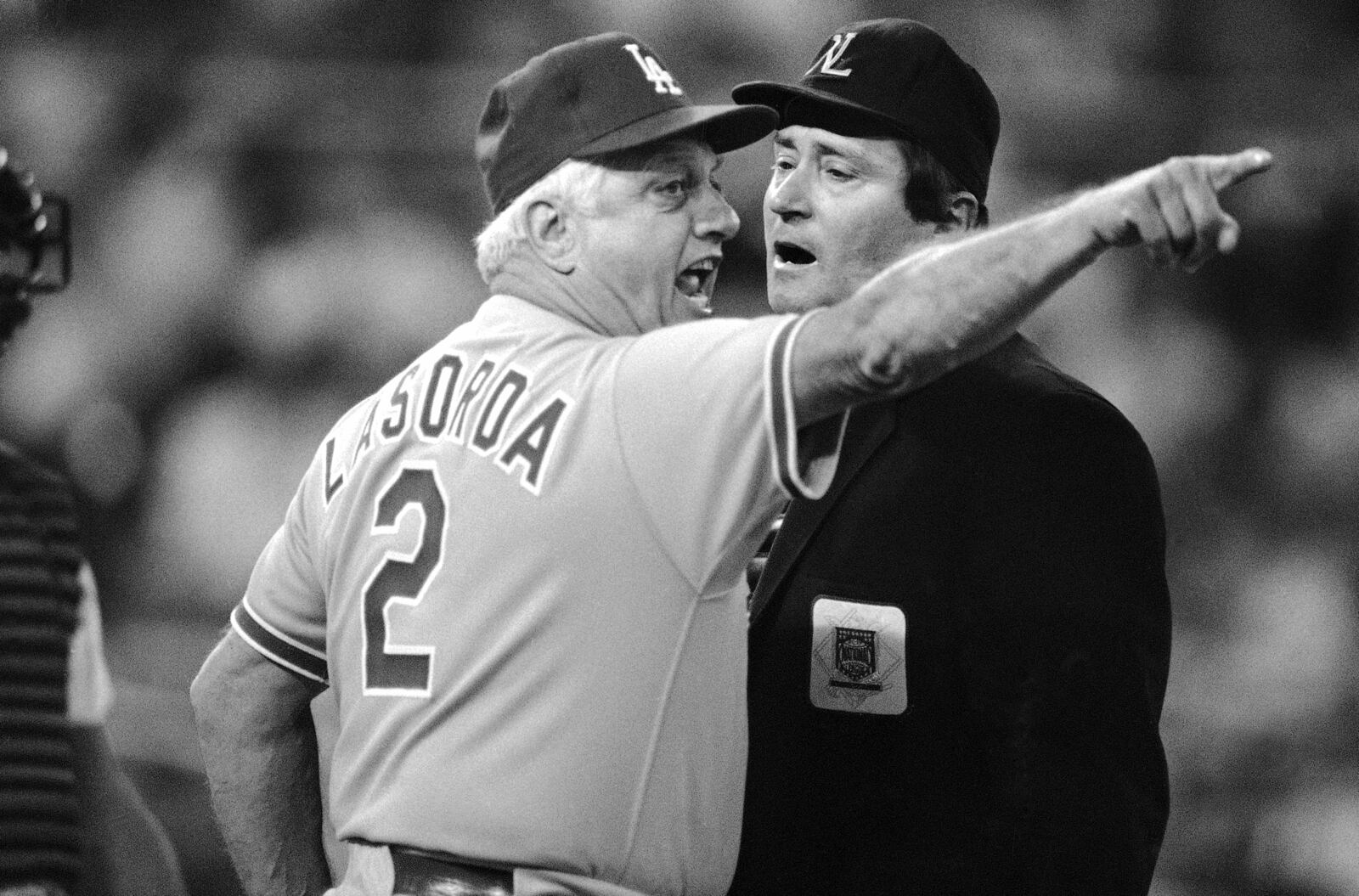 FILE - Los Angeles Dodgers manager Tommy Lasorda, left, argues with home plate umpire Fred Brocklander during the second inning of a National League baseball game against the Philadelphia Phillies in Philadelphia, in this Saturday, Sept. 6, 1986, file photo. (AP Photo/Charles Krupa, File)