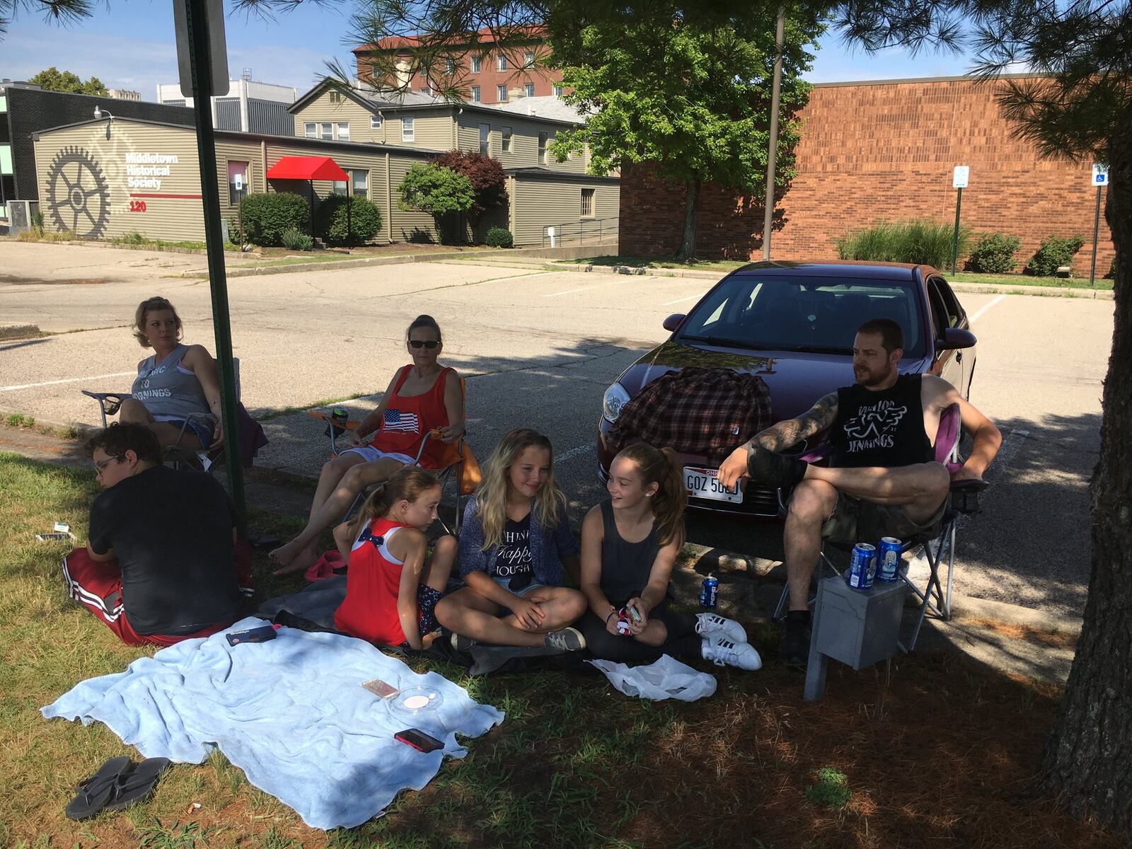 Rhonda Sowder of Middletown staked out a shady spot to beat the heat for Wednesday’s Fourth of July Parade. They arrived about half-hour before the parade started. ED RICHTER/STAFF