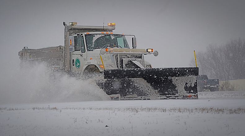 ODOT trucks plowing and salting Interstate 675 in Greene County Feb. 15, 2021. MARSHALL GORBY/STAFF