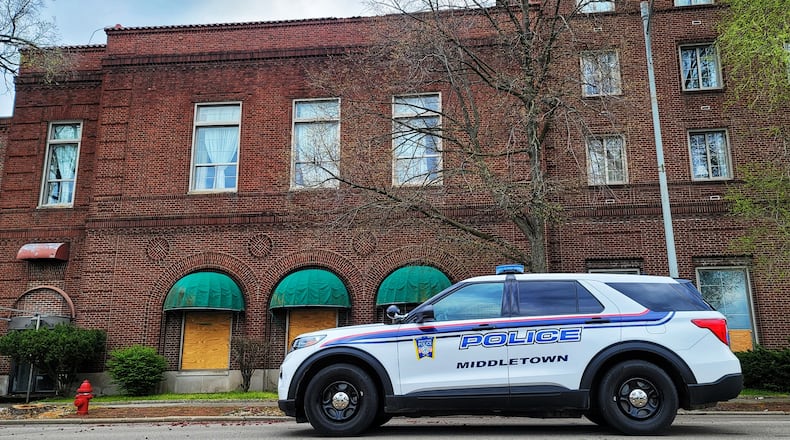 City officials inspected the 99-year-old Manchester Inn recently after tiles fell off the building and onto the sidewalk and road. City council will vote Tuesday whether to pay a $161,000 settlement to the owner of two downtown properties. NICK GRAHAM/STAFF