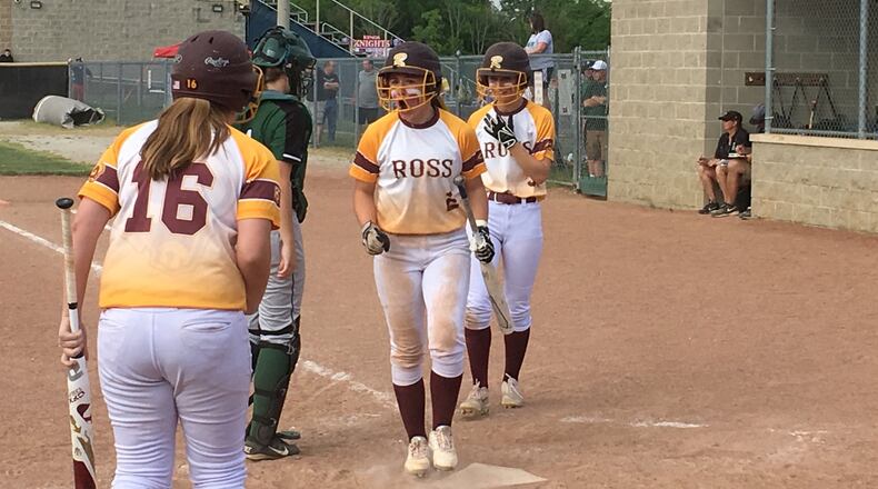 Haley Grau (16) of Ross prepares to congratulate Emily Poling (2) and Maddy Foster (3) after they scored runs in the fifth inning of Tuesday’s Division II district semifinal against Badin at Kings. RICK CASSANO/STAFF